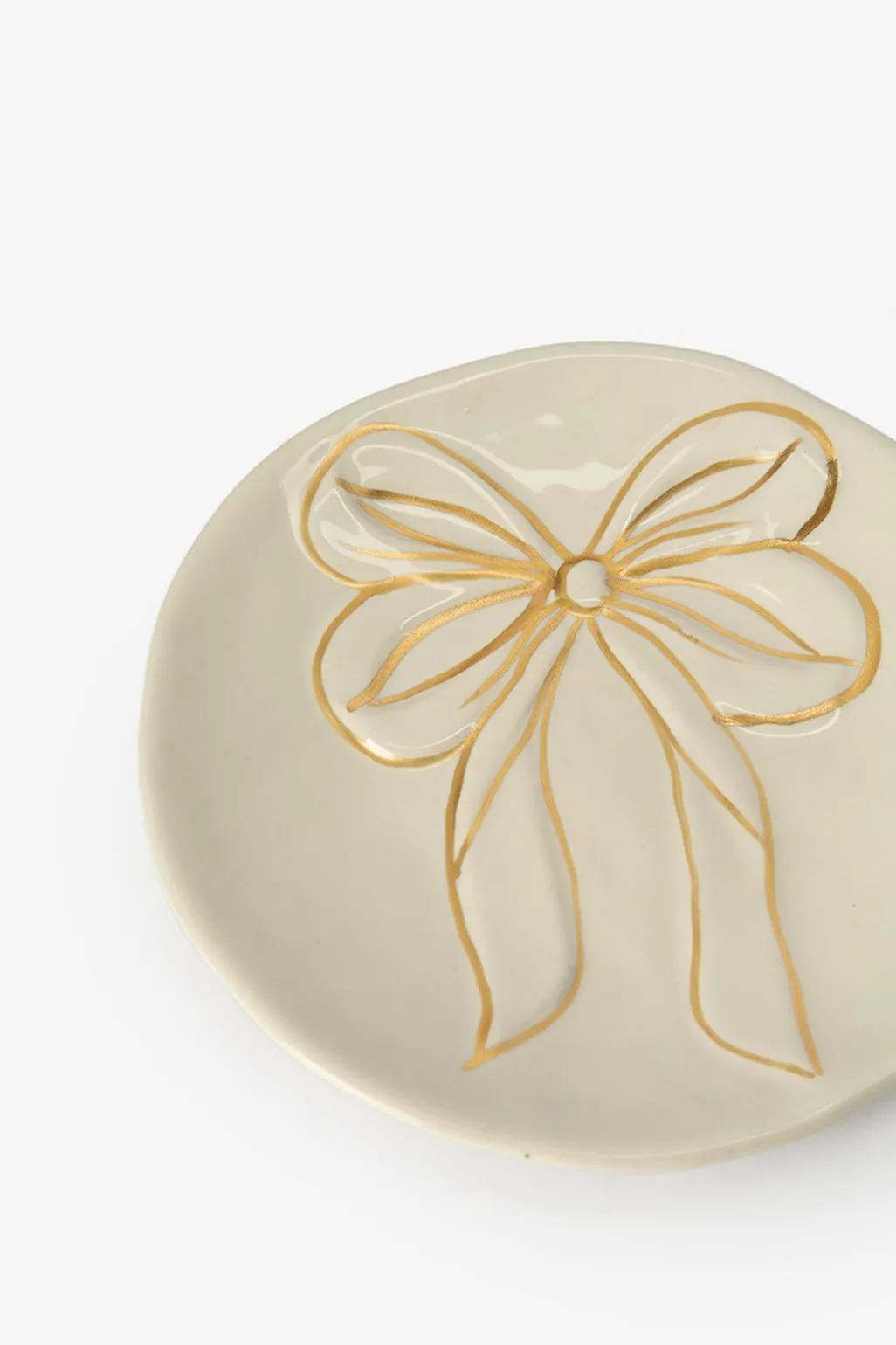 Beige dessertbord met gouden strik
