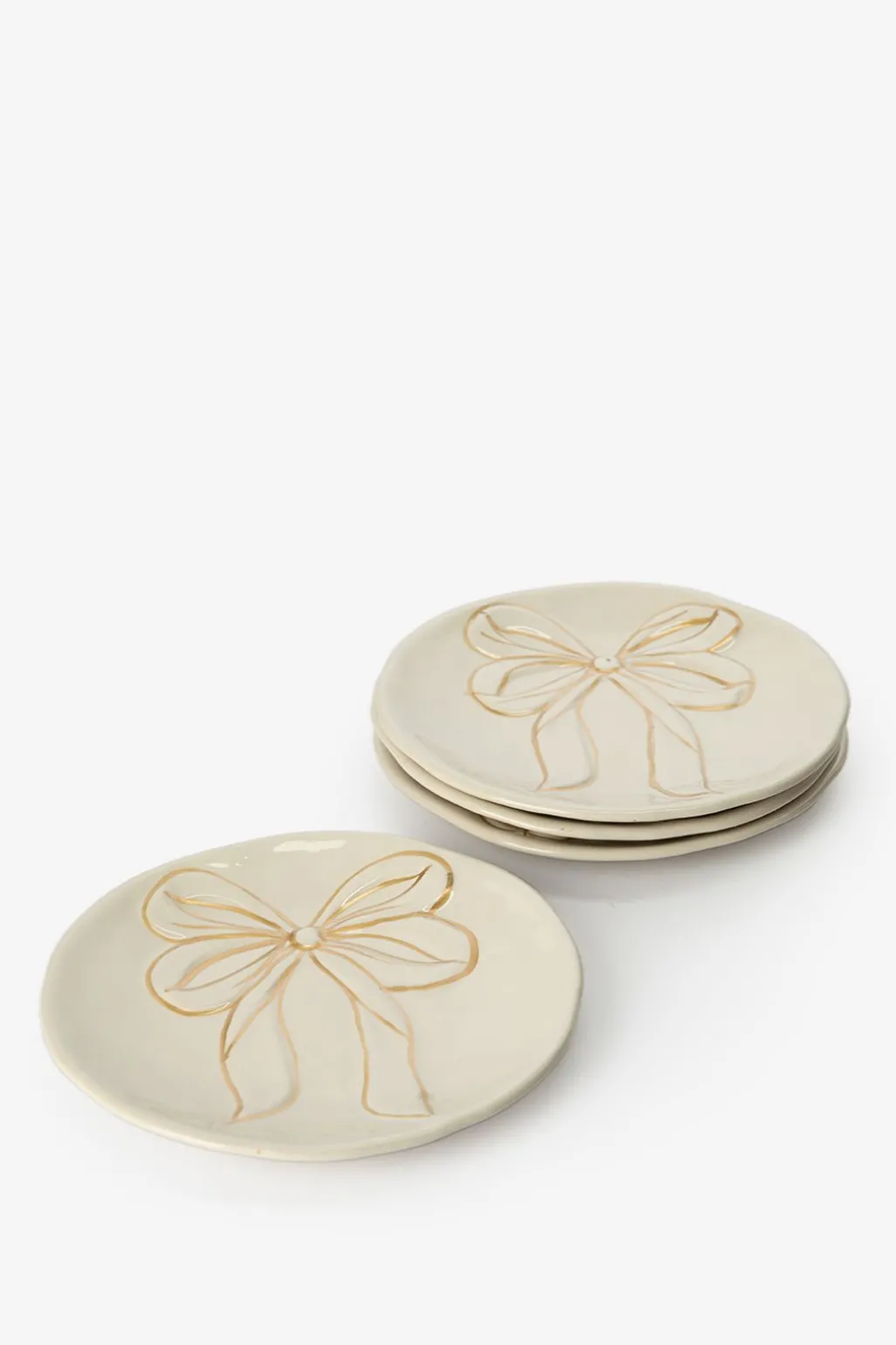 Beige dessertbord met gouden strik