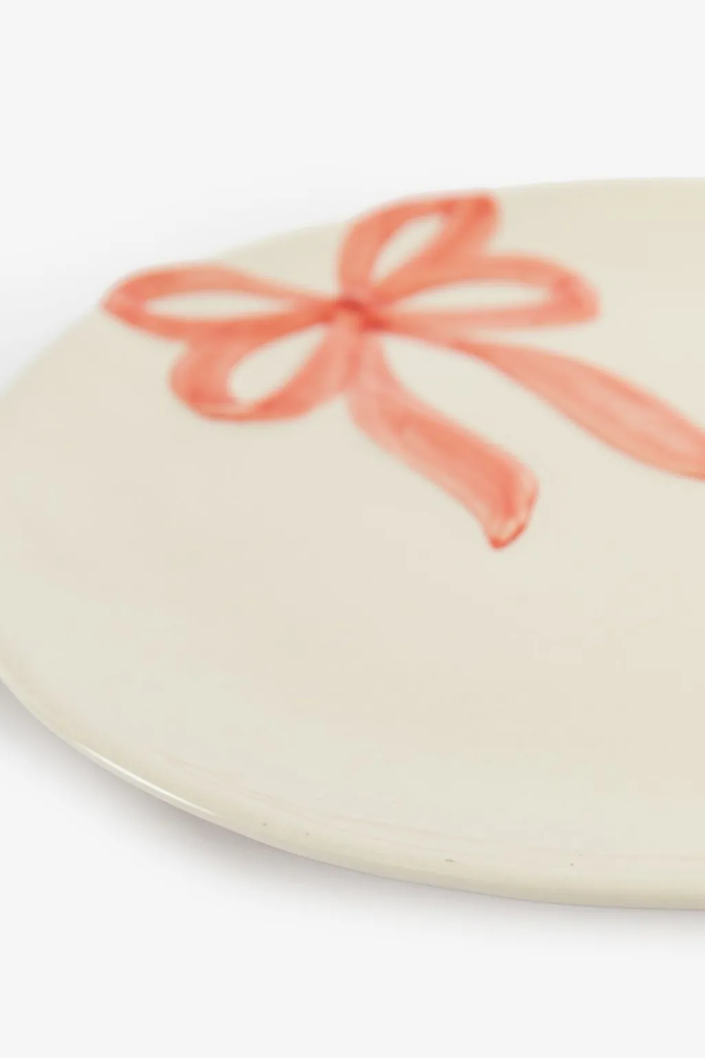Beige ontbijtbord met roze strik