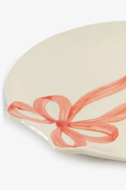 Beige ontbijtbord met roze strik