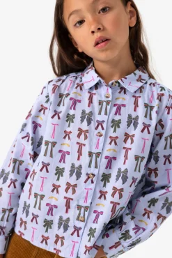Blauwe blouse met strikkenprint