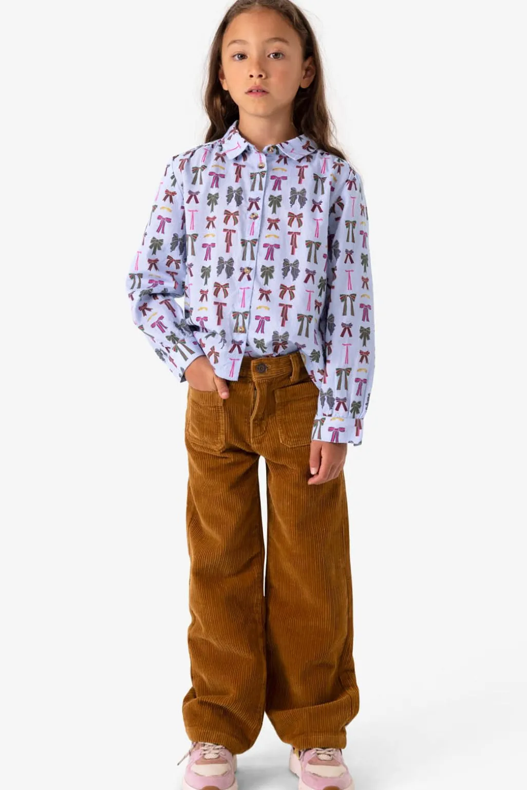 Blauwe blouse met strikkenprint