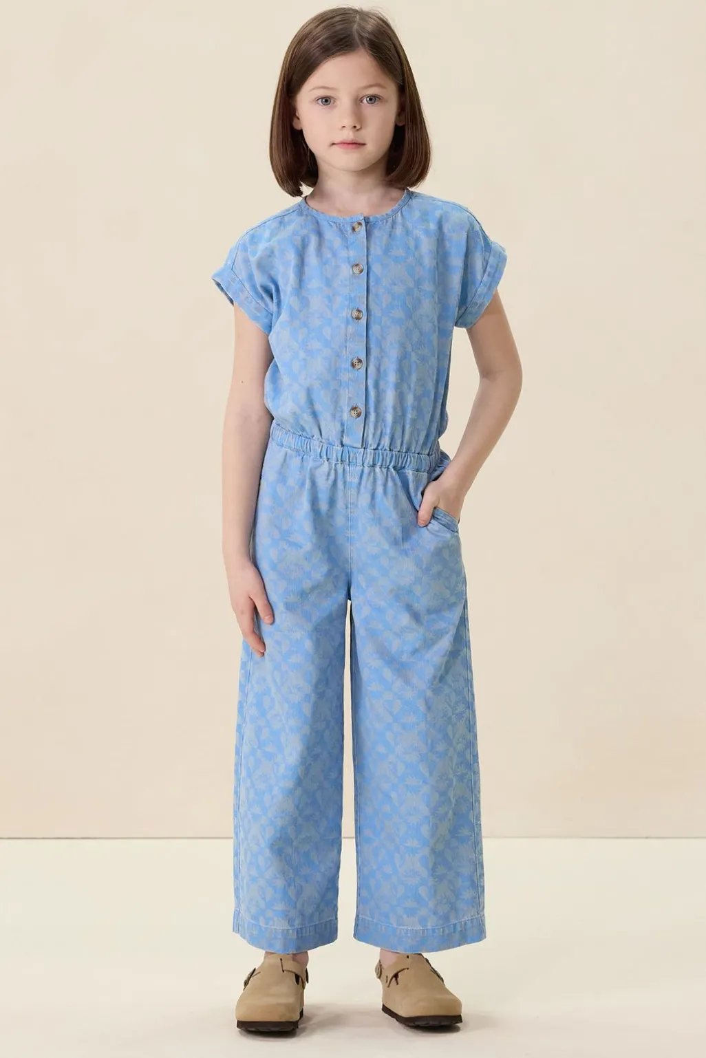 Blauwe denim jumpsuit met print