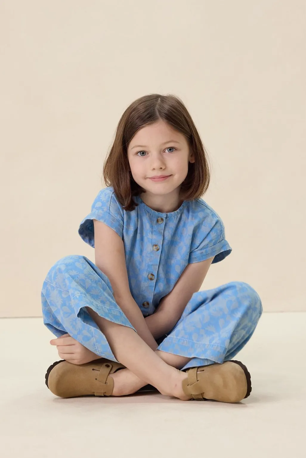 Blauwe denim jumpsuit met print