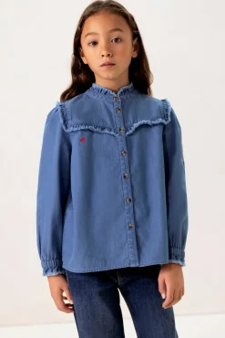 Blauwe denim ruffle blouse