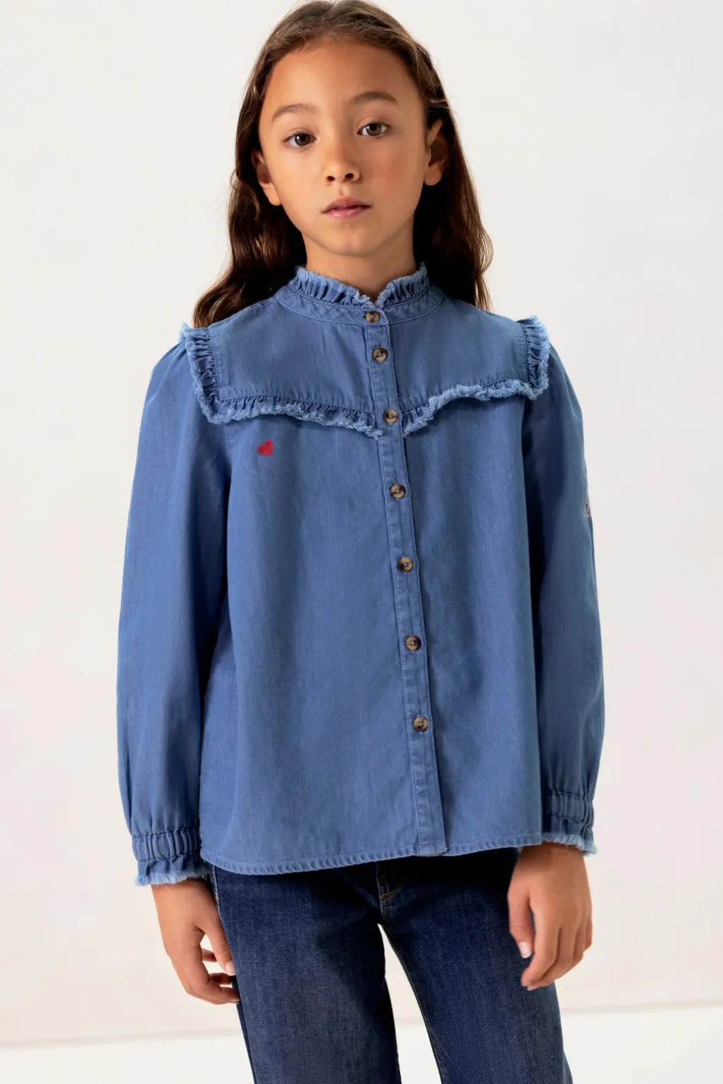 Blauwe denim ruffle blouse