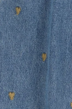Blauwe tapered jeans met hartjes embroidery