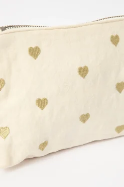 Crèmekleurige toilettas met gouden hartjes