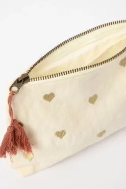 Crèmekleurige toilettas met gouden hartjes