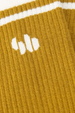 Donkergele sokken met logo