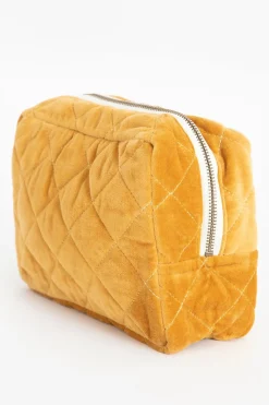 Donkergele velvet toilettas