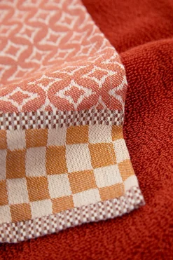Donkeroranje handdoek en theedoek