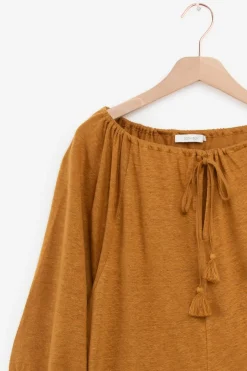 Goudbruine top met kwastjes