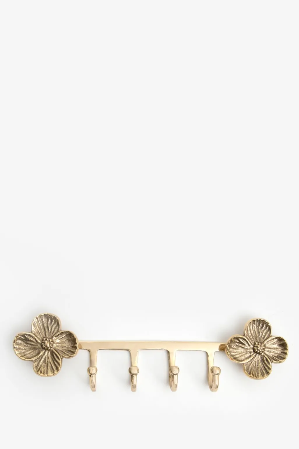 Goudkleurige kapstokhaken met bloemen