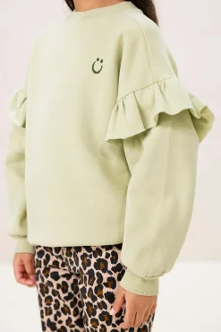 Lichtgroene oversized sweater met ruffles en smiley patch