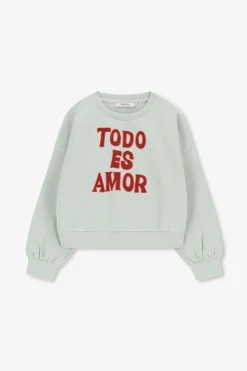 Lichtgroene sweater met tekst