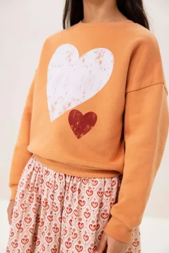 Lichtoranje oversized sweater met artwork
