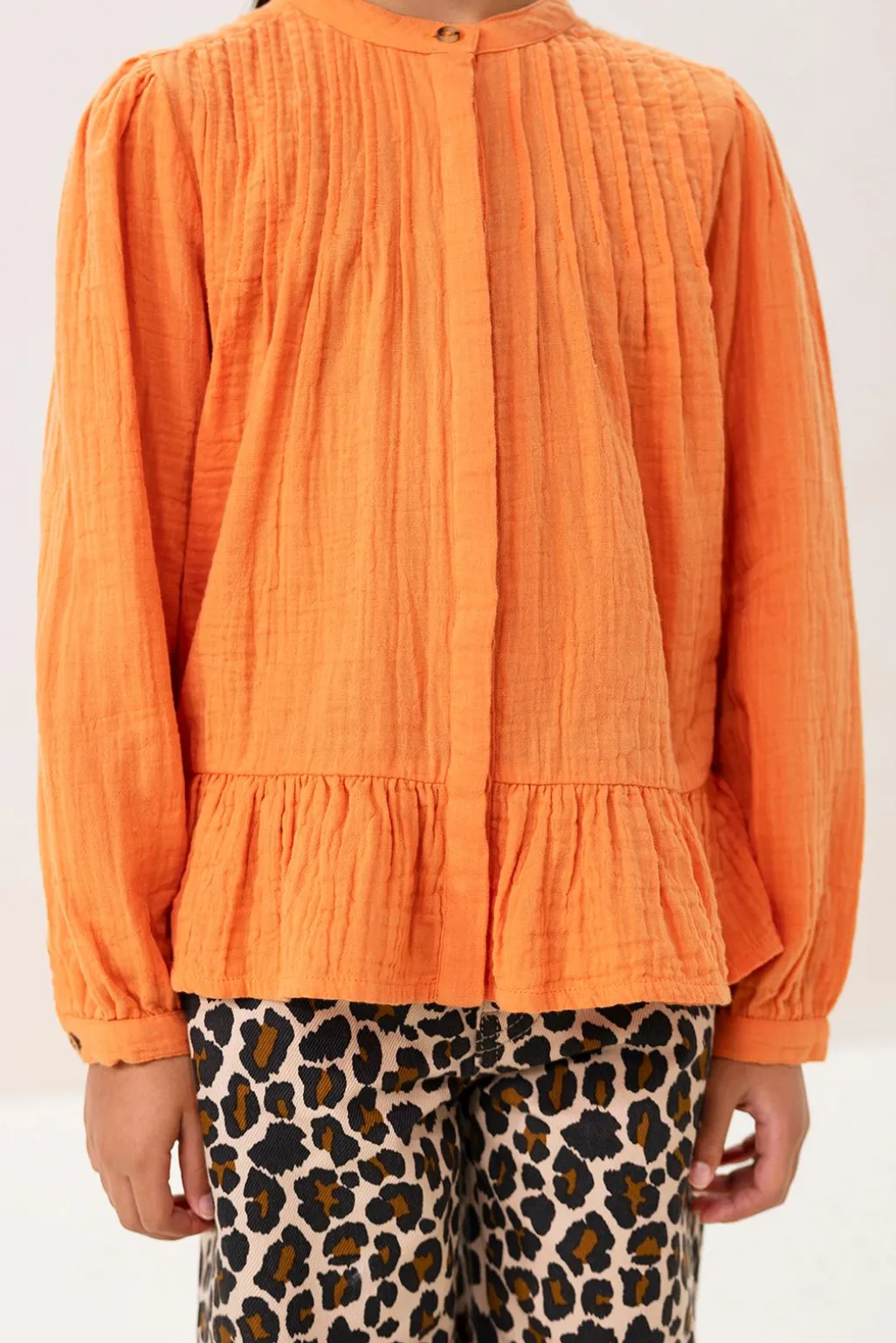 Oranje blouse met pintuck details