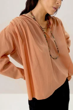 Oranje blouse met plooiing