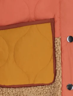 Oranje doorgestikt jack met teddy details