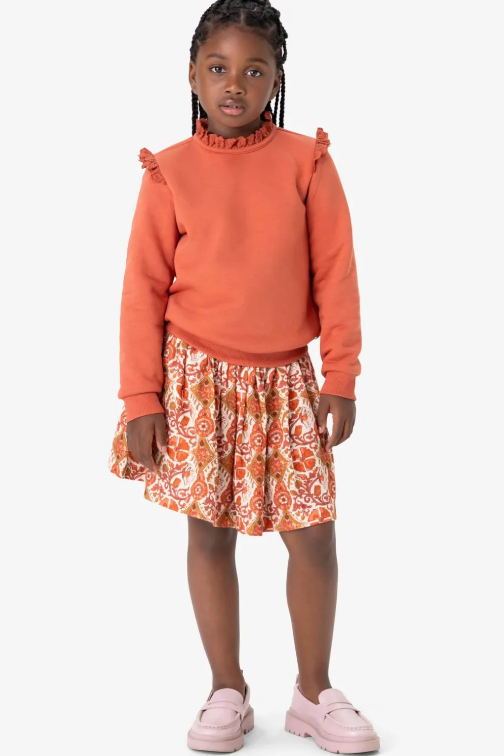 Oranje sweater met ruffle details