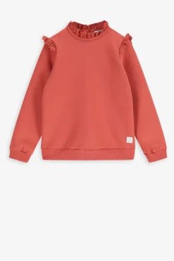 Oranje sweater met ruffle details