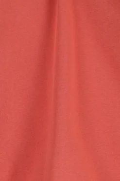 Oranje sweater met ruffle details
