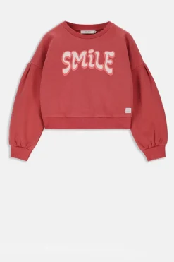 Rode sweater met lage schouders en artwork