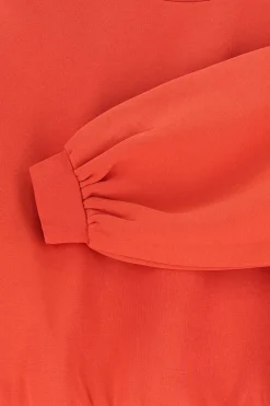 Rode sweater met pofmouwen