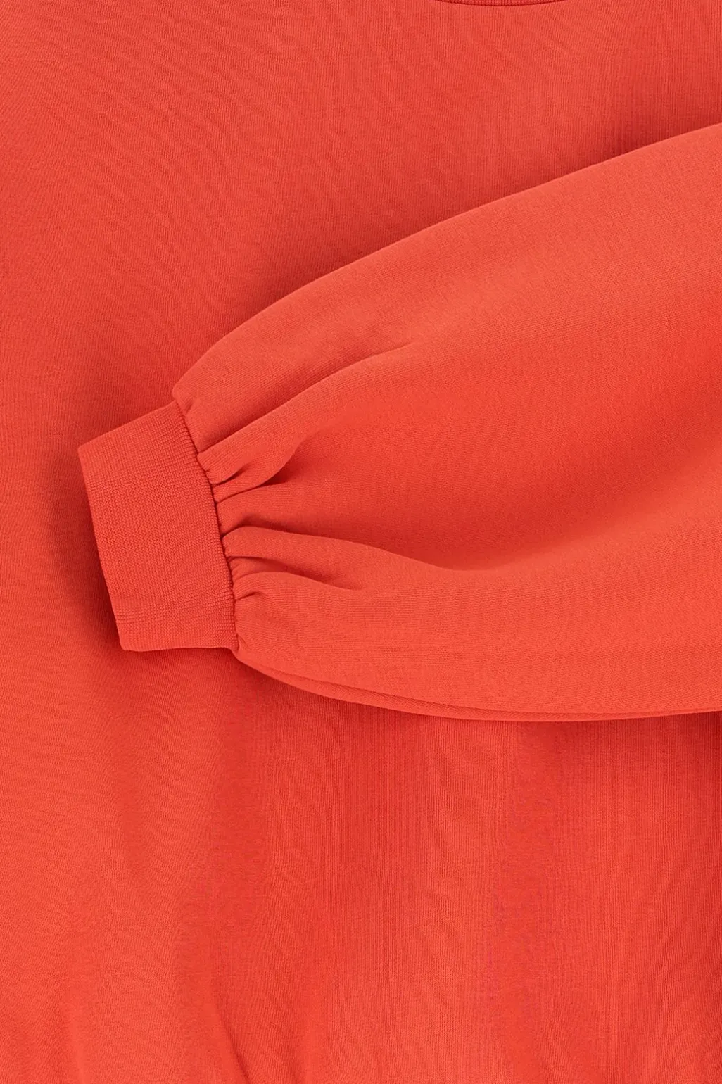 Rode sweater met pofmouwen