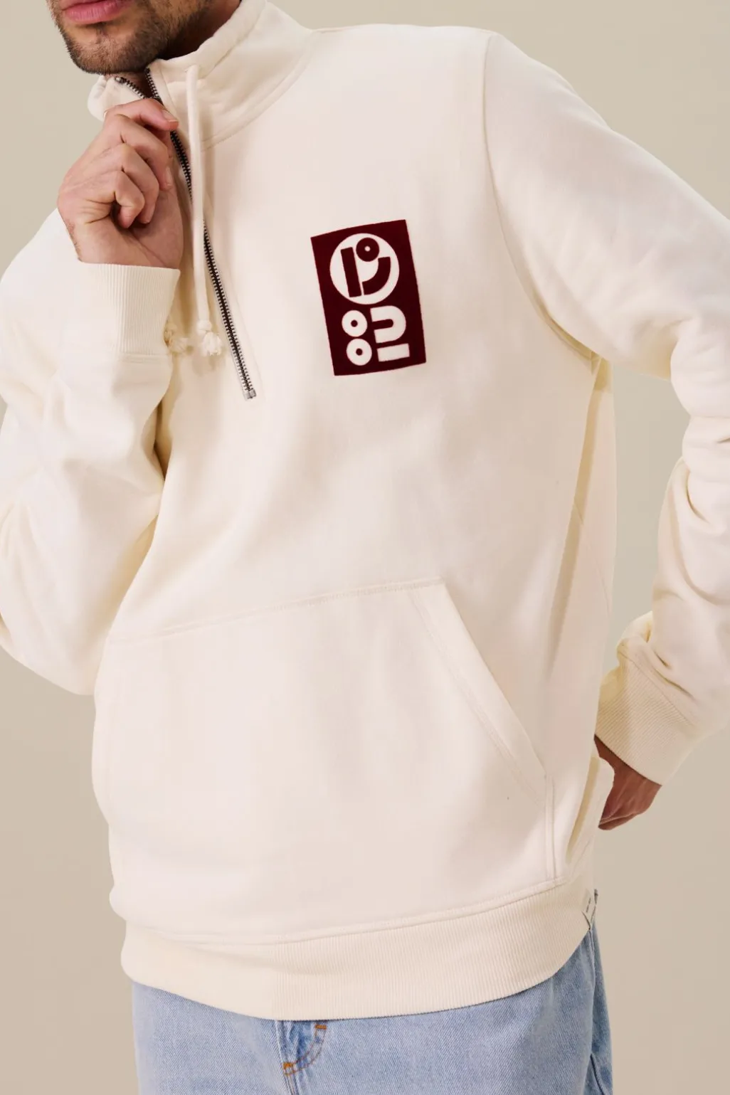 Witte sweater met rits en artwork