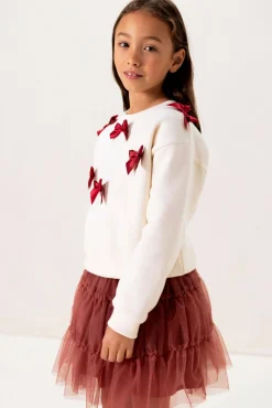 Witte sweater met strikjes